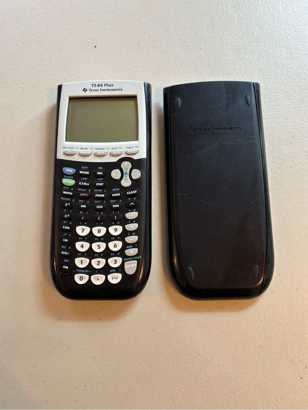 Texas Instruments Black and White TI-84 Plus Graphing Calculator